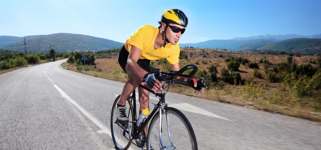 Cyclist riding a bike on an open road